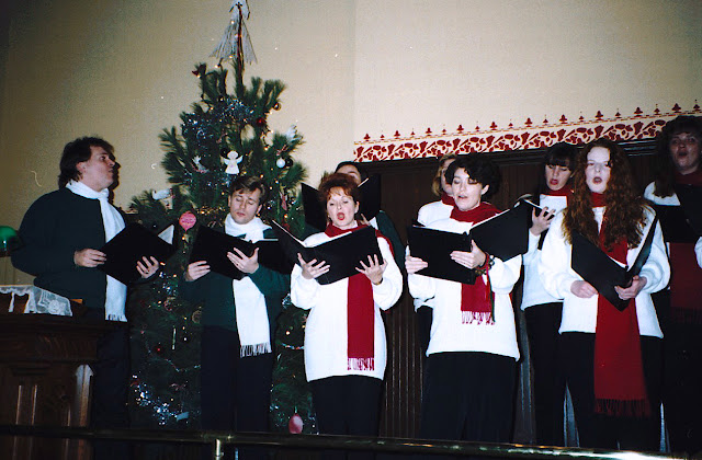 Joel Haslam, second from the left, sings at a Cumberland Museum Stairwell Caroller Christmas concert