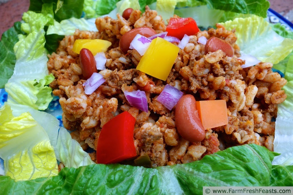 A easy and fast pizza for a family Pizza Night--combining leftover taco meat with vegetables and grains on a tortilla pizza covered with cheese.