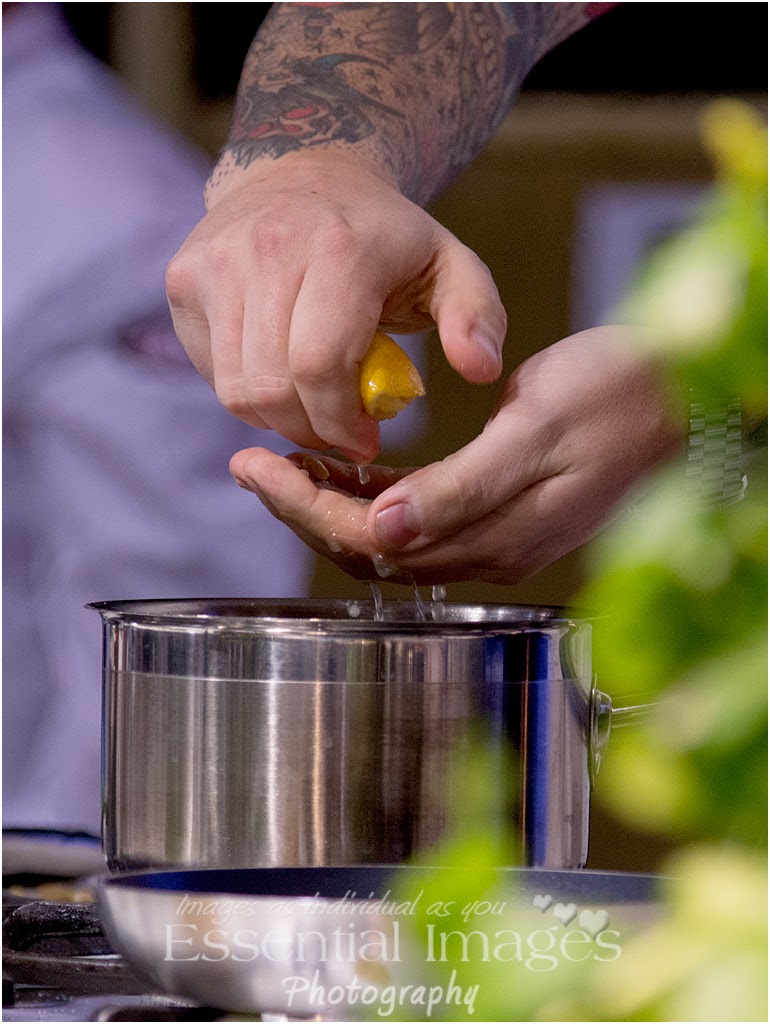 Squeezing lemon through fingers in cookery demo