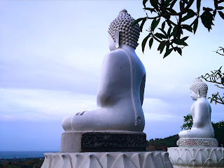 View Of Big White Buddha Statues With Natural Scenery Around At Buddhist Temple, North Bali, Indonesia