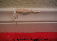 This Medium-density fiberboard baseboard was damaged by furniture