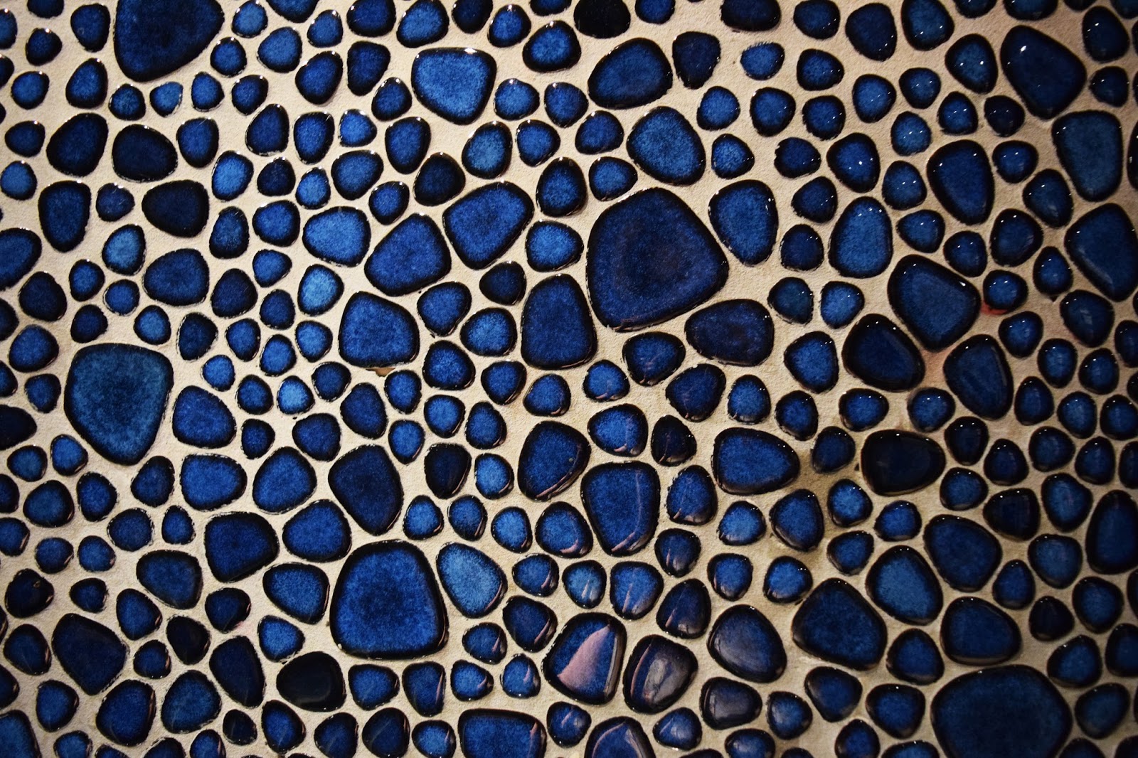 a closer detail of the blue mosaic stones on the walls