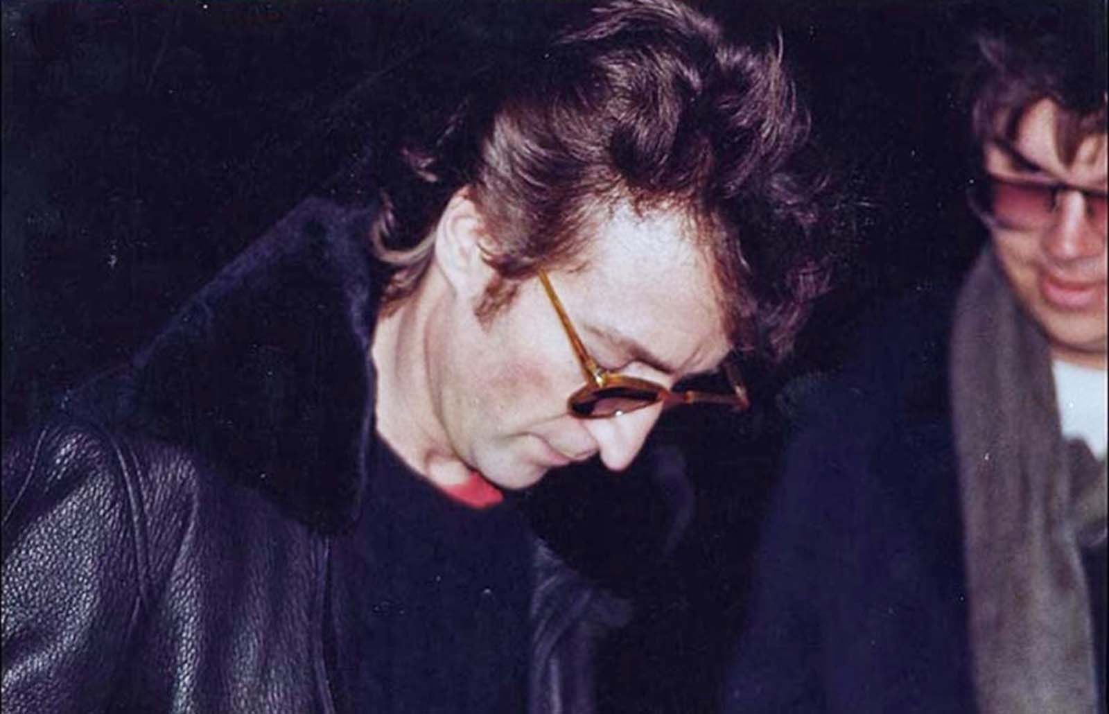 Image result for john lennon signing autographs