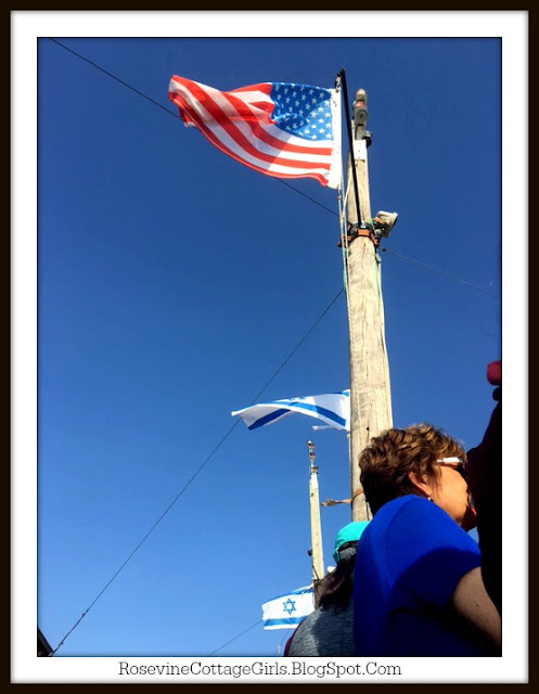 Israli and US Flag flying at the Sea of Galilee