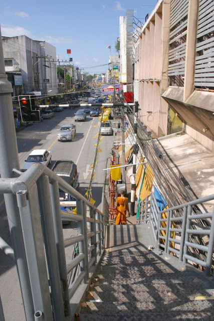 City center Nakhon Sri Thammarat and the cross over bridges. People generally do not cut across to the other side and notice barriers along side walks to discourage pedestrians jay walking.
