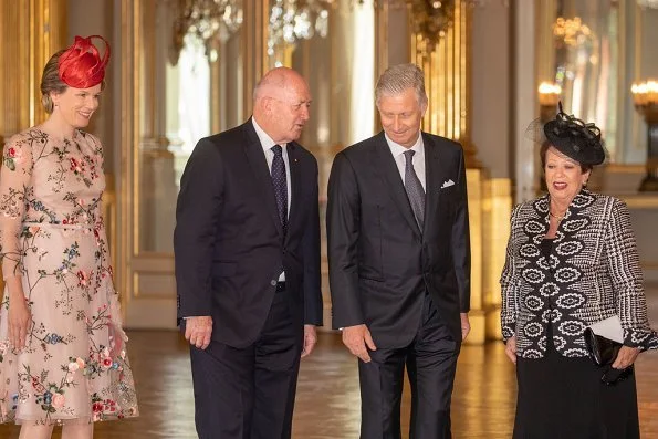 Queen Mathilde wore Natan Couture floral dress, Maison Natan dress, and Aramani blue one shoulder silk dress