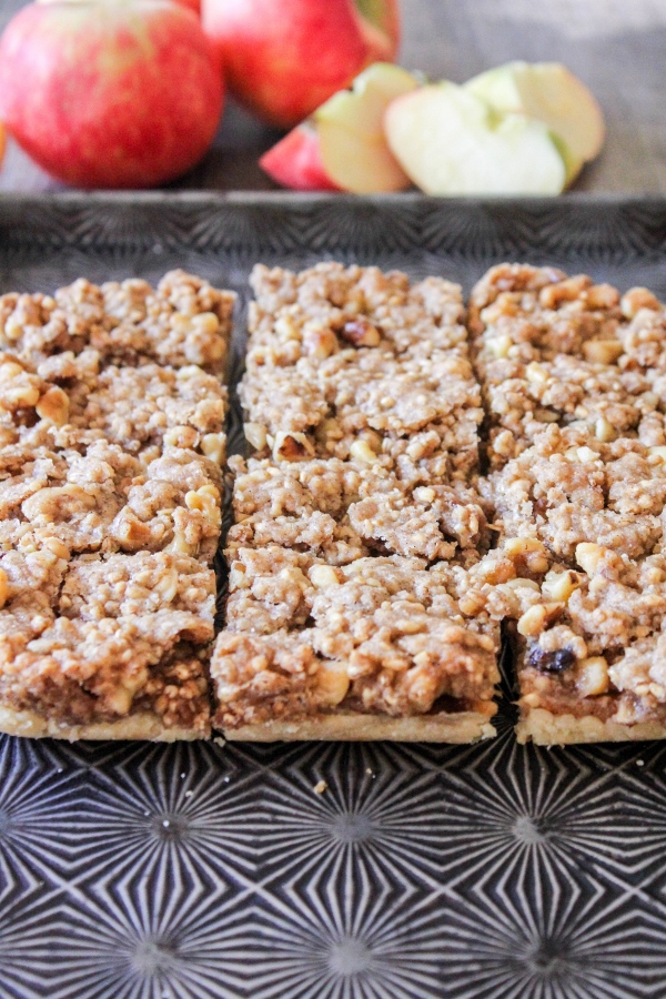 These Apple Walnut Bars are addicting and so easy to make! A sweet apple filling is layered between a shortbread crust and a crunchy topping, making them a hit with everyone!