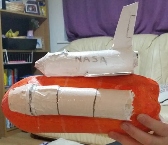 A space shuttle made from a bottle and toilet rolls