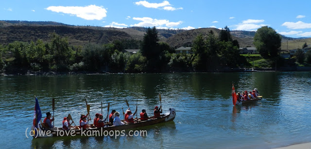 The canoes leave to go downstream to Riverside Park