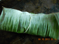 seared fish in banana leaf
