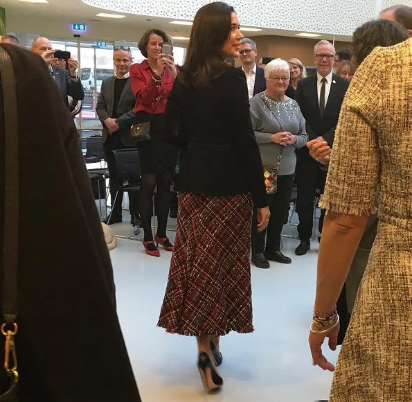 Crown Princess Mary wore Alexander McQueen High waisted boucle tweed midi skirt. The Princess wore a tweed midi skirt by Alexander McQueen