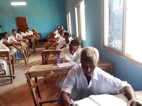 Photos of a 60-year-old Man Sitting for a Secondary School Examinations Goes Viral