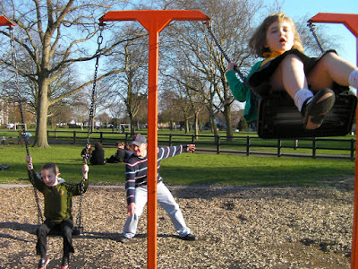 alternating timed swinging spring day in the park