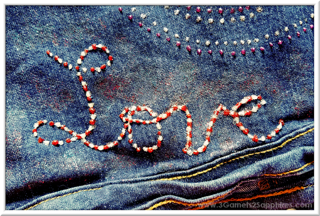 Artsy painted abstract background effect on denim with Glitter Fabric Paint  |  3 Garnets & 2 Sapphires