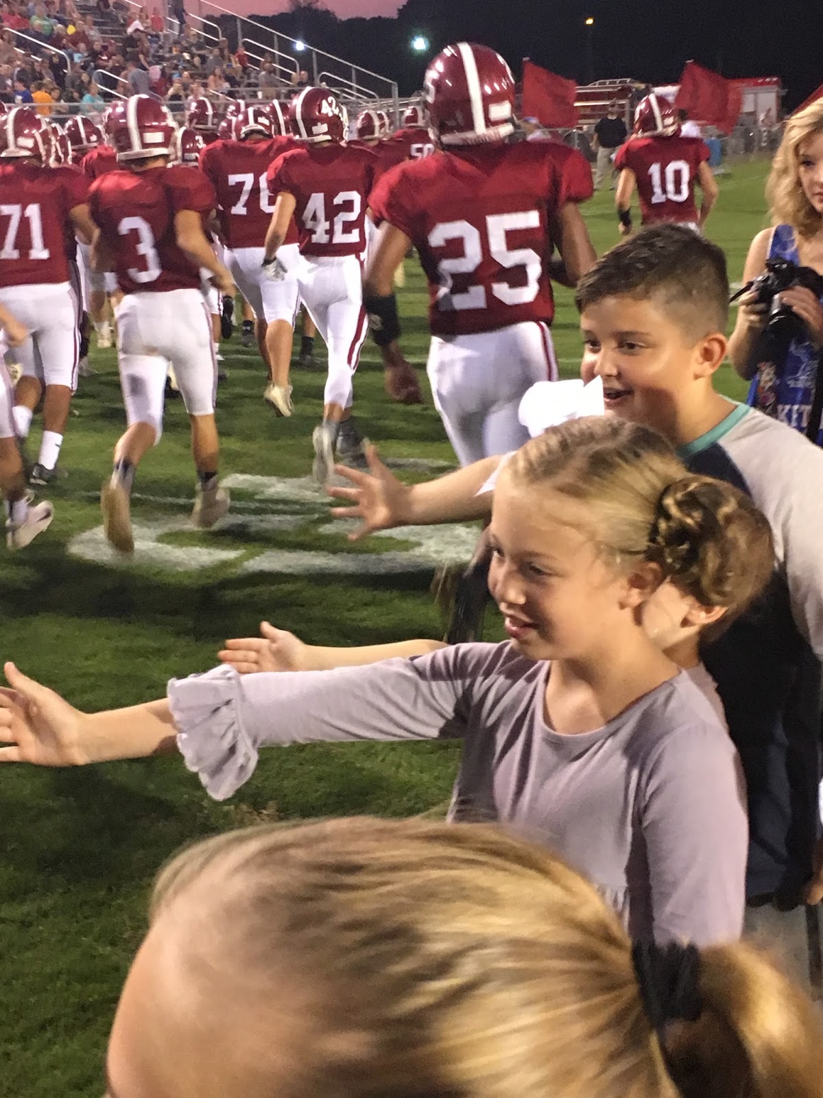 Maggie Elizabeth Feeding the Football Team