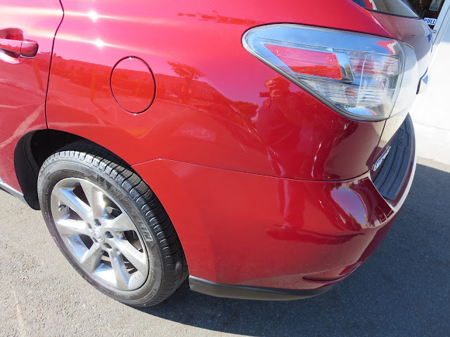 Dent & scrapes on quarter panel & bumper are gone after collision repairs.