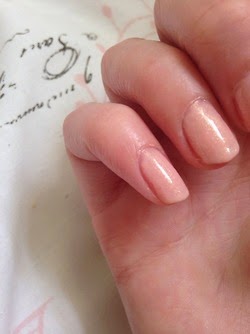 Nails painted in a nude chanel nail polish