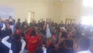 UNILORIN Lecturer Orders 400L Students To Kneel Down And Raise Their Hands As Punishment For Noise Making – See Photos