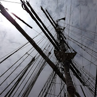 ships mast looking upward at a sailing ship mast