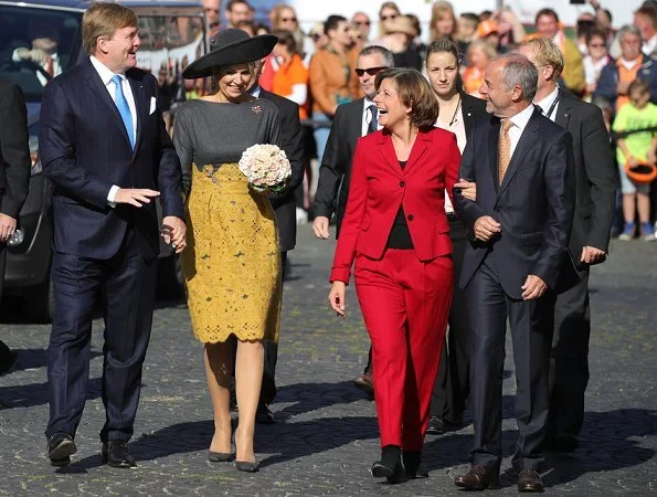 Governor of Rhineland-Palatinate Malu Dreyer and her Husband Klaus Jensen. Queen Maxima wore Natan wool top and yellow lace skirt. visit Germany