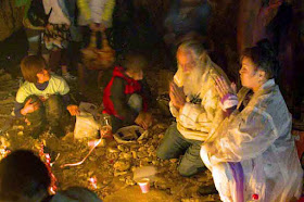 prayer and rituals with a priestess in a candle-lit cave