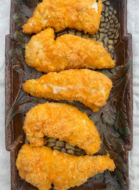 Platter of cheese doodle chicken tenders.