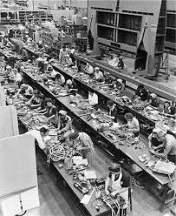 1940's. Factory assembly line workers