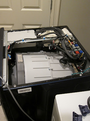 broken washing machine with cover removed
