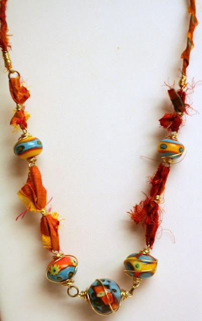 Summer heat: lampwork by Cherry Obsidia, brass wire, sari silk, wire-wrapping, ooak necklace :: All Pretty Things