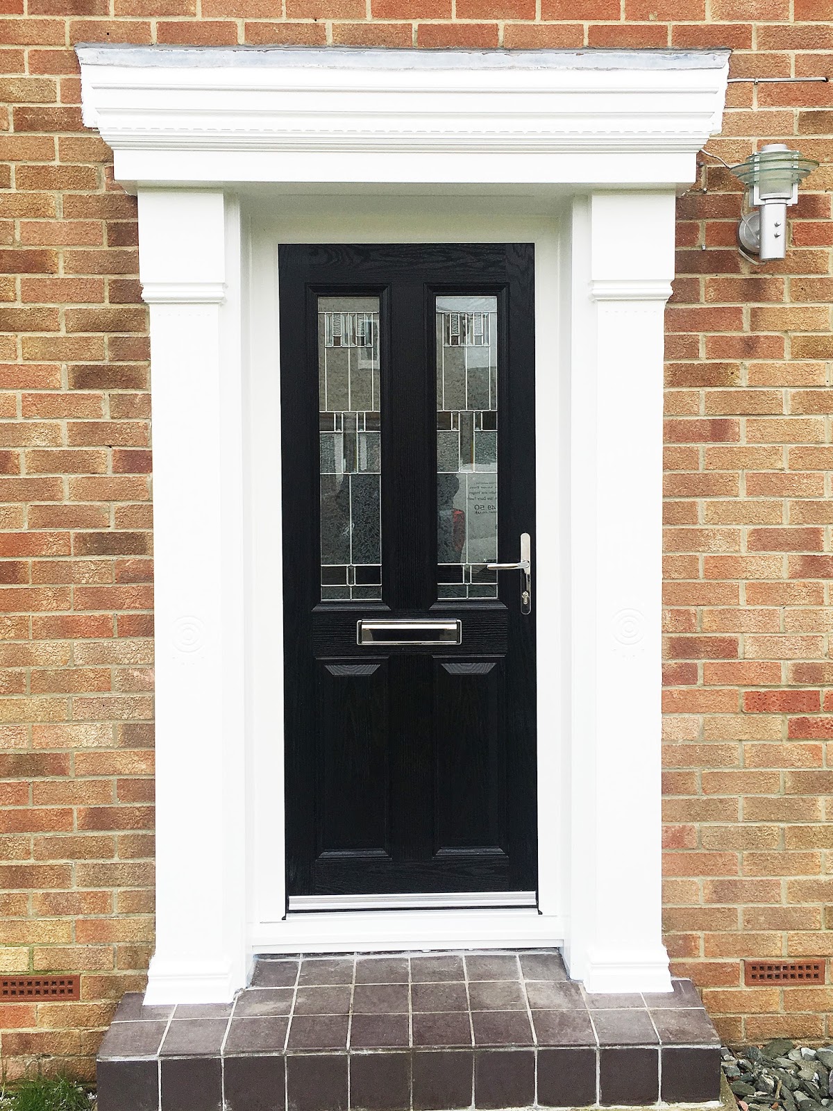 A Classical Look with a Modern twist; Black Composite Door with modern glass design & Cambridge
