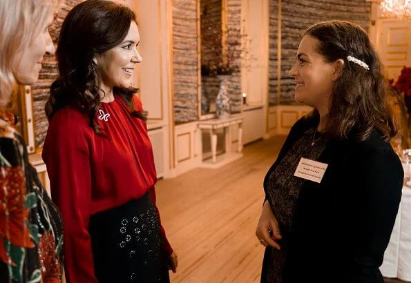 Crown Princess Mary wore a red sil blouse by Hugo Boss. Boss Banora8 blouse. black embroidered skirt at Christmas reception