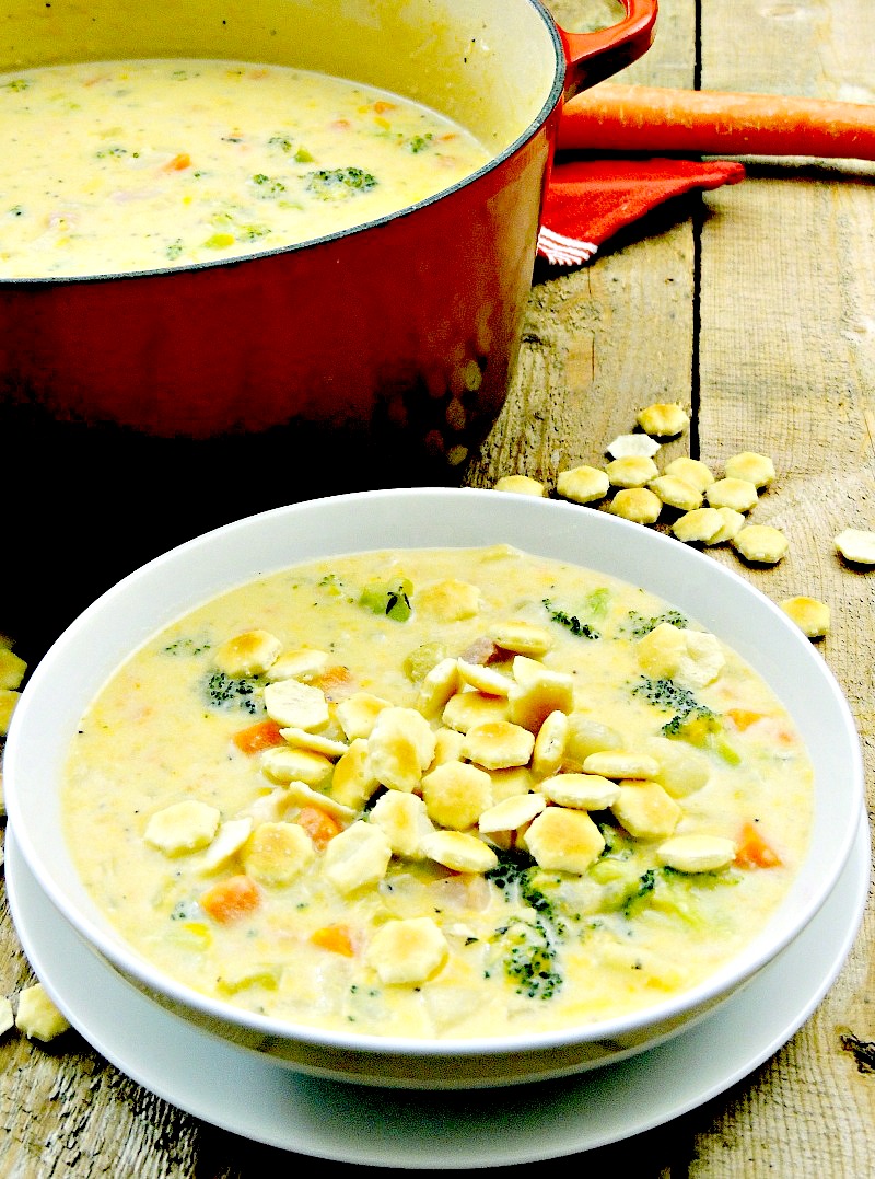 This Cheesy Ham and Vegetable Chowder recipe is easy to make, rich and creamy, cheesy, and loaded with veggies. It is comfort food at it's finest! #ham #pork #vegetables #cheesy #soup #chowder #easy #recipe | bobbiskozykitchen.com