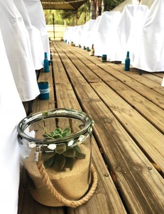 Rustic wedding at Thatch Haven - outside deck Thatch Haven deck with succulent in glass jar