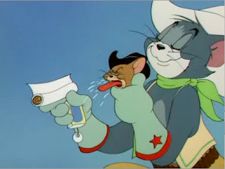 still from Texas Tom - Tom, with Jerry's unwilling assistance, rolls a cigarette and smokes it in one drag. Censored in the UK.