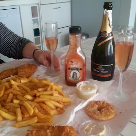 Fish and chips and a bottle of sparkling wine.