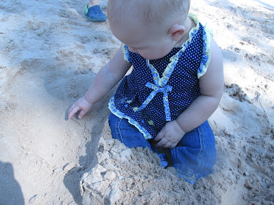 Grandbaby feeling the sand -Vickie's Kitchen and Garden
