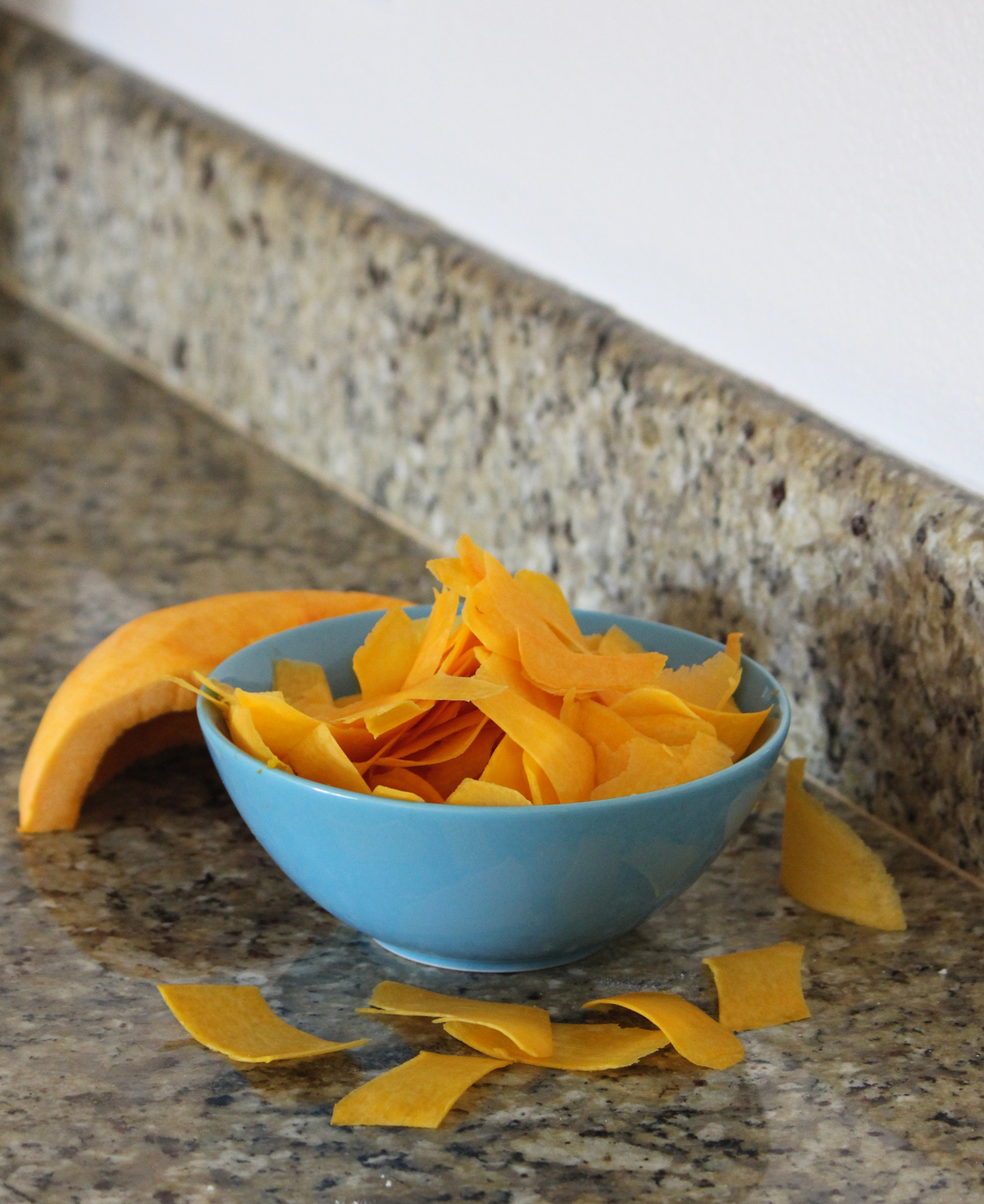 Use a vegetable peeler to make super thin slices of pumpkin, which makes it easier to arrange them into a spiral shape
