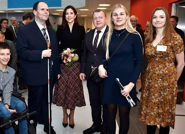 Crown Princess Mary wore Alexander McQueen High waisted boucle tweed midi skirt. The Princess wore a tweed midi skirt by Alexander McQueen