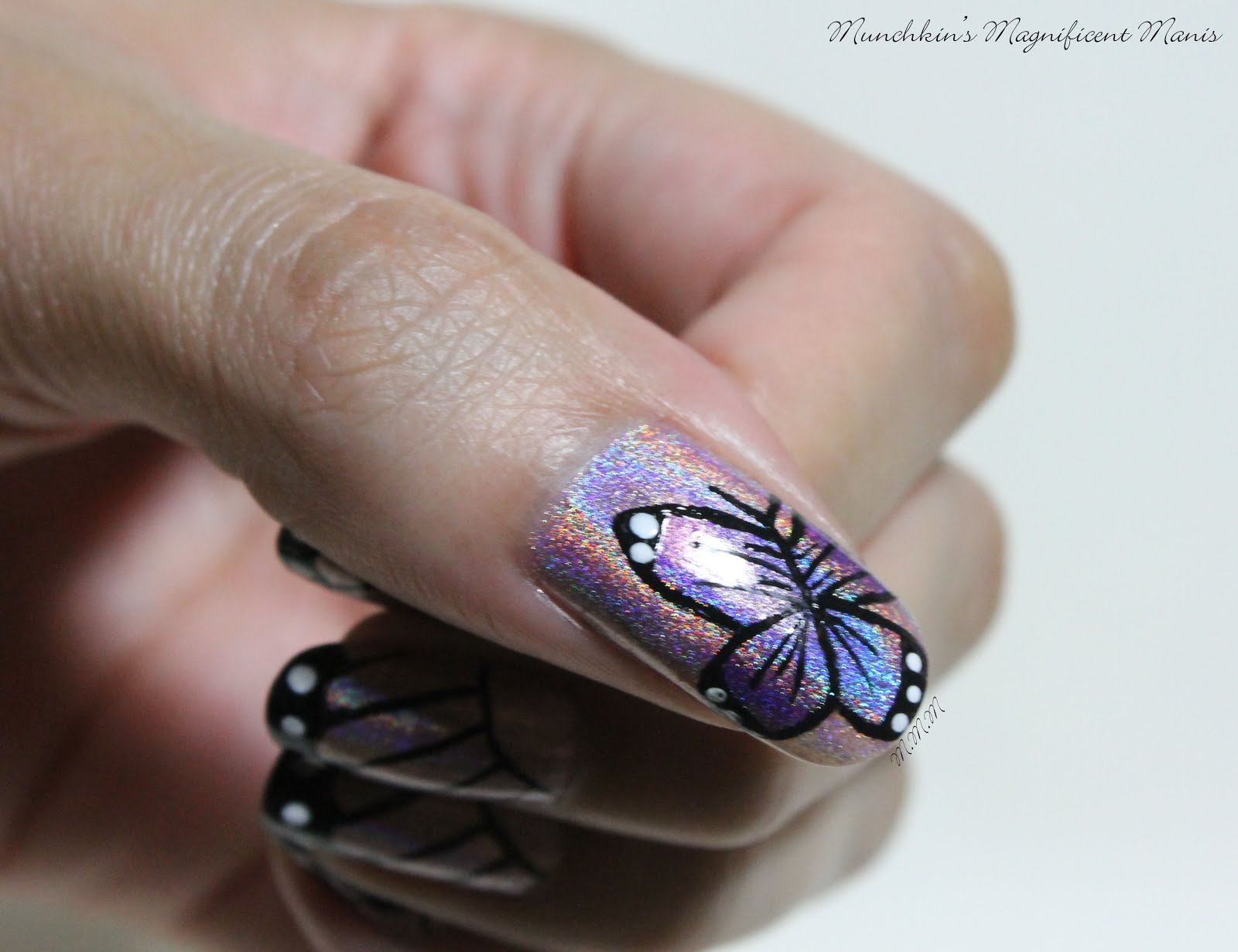 Munchkin’s Magnificent Manis Butterfly Kisses Butterfly Nail Design