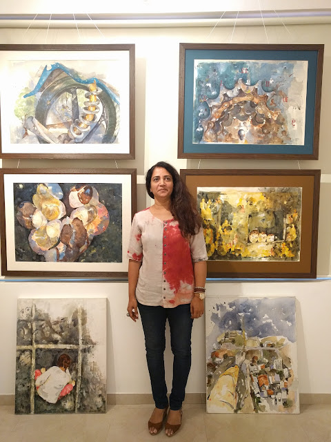 Amita Goswami with her paintings at the second edition of Emerging Artists Show at Indiaart Gallery, Pune (www.indiaart.com)
