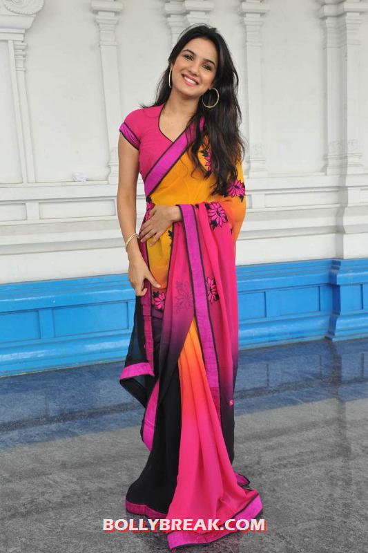Jasmine posing in a bright colorful saree - jasmine in red saree hot photos