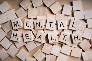 wooden blocks spelling out mental health