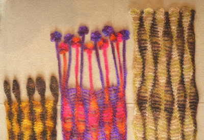 The ends of three wavy-striped scarves (L-R) Brown leaves fringe on gold/brown, flower motifs dangle from purple/pink/orange, curved scalloped shaped ends on green stripes