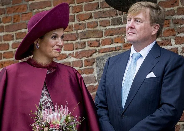 Dutch Queen Maxima wore a new Natan branded silk cape and Natan inlaid design dress.Natan suede Pumps