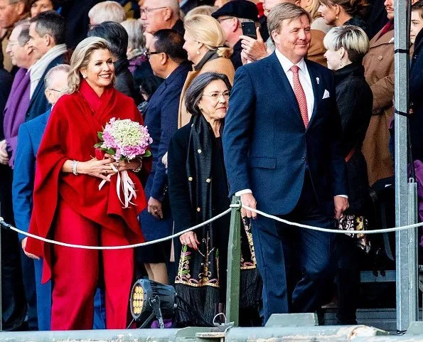 Queen Maxima wore a red top and red trousers. by Natan.Sarah's clutch bag. Carré Royal Theatre and around Amstel River