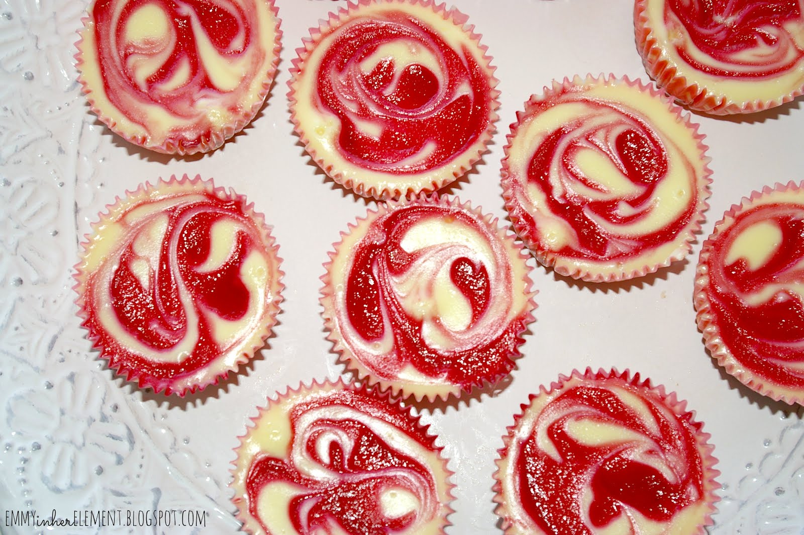 Mini cheesecakes with raspberry swirls