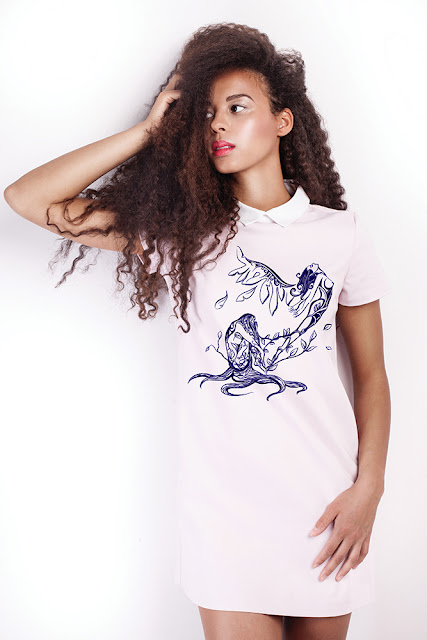 beaufiful african american Girl rocking art on clothes to promote her artwork, artists can promote their artwork creatively with clothes and their closet