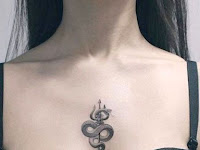 Female Middle Chest Piece Tattoo