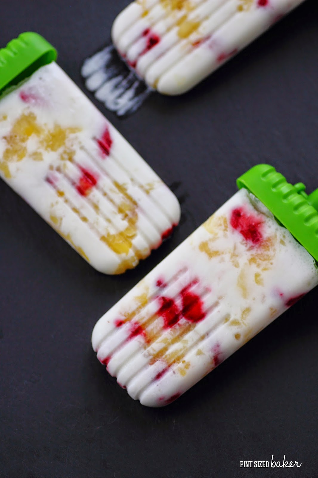 Kids young and old can make and enjoy these Pineapple Strawberry Coconut Popsicles Real, simple ingredients that are dairy free and naturally gluten free.
