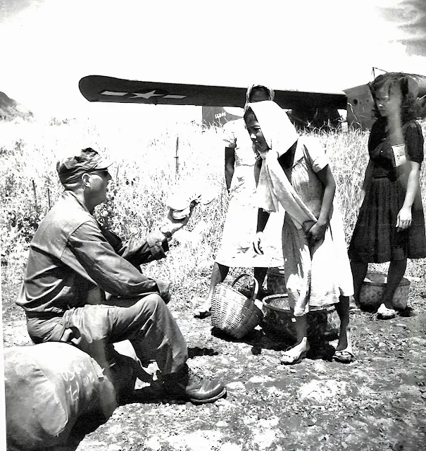 US Army soldier buying banana at Lipa Airstrip before flying out to Okinawa.  Image source:  United States National Archives.